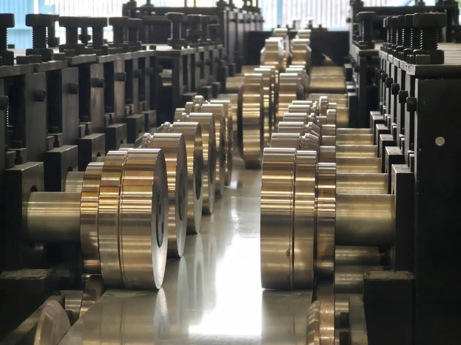 Roll forming machine with precision rollers and forming stations